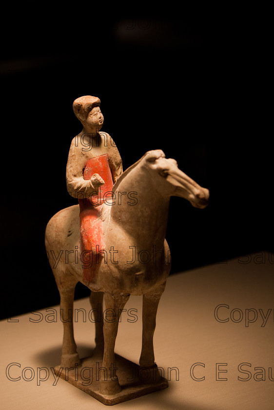 IMG 2759 
 Terracotta clay horseman from the Han dynasty (206 BCE - 8CE) 
 Keywords: Qin, Small, ancient, art, brown, chinese, clay, culture, dark, dynasty, head, history, horse, horseman, red, rider, sculpture, shadows, statue, terracotta