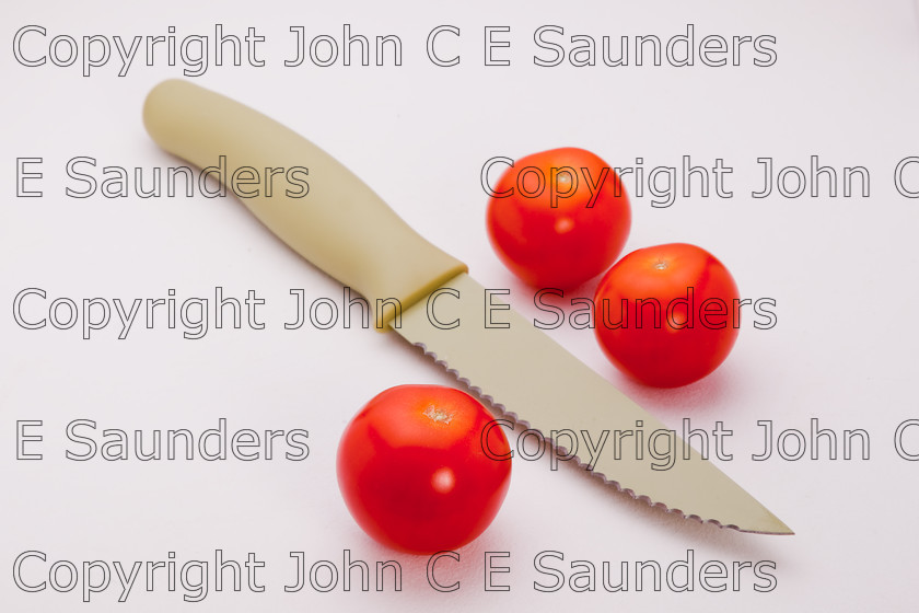 IMG 7790 
 Tomatoes and knife 
 Keywords: tomatoes,red,cherry,three,fruit,food,ingredients,healthy,isolated,white background,knife