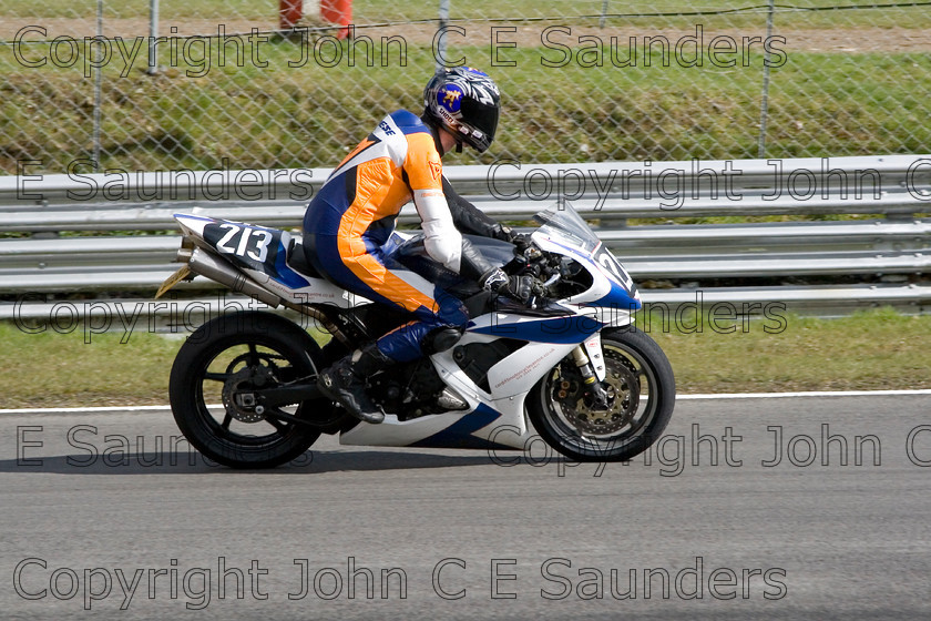 -6883 
 Racer 03 
 Keywords: motorcycle,motorbike,race track,racing,motorcyclist,motorsport,England,UK,Brands Hatch