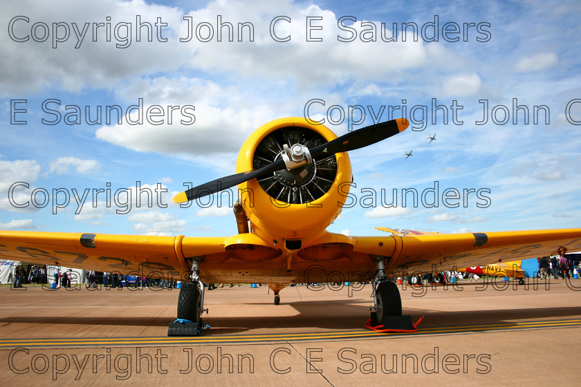 IMG 3360 
 Yellow fighter 
 Keywords: aeroplane,aircraft,plane,fighter,propeller,yellow,wings,airfield,sunny,clouds,airshow