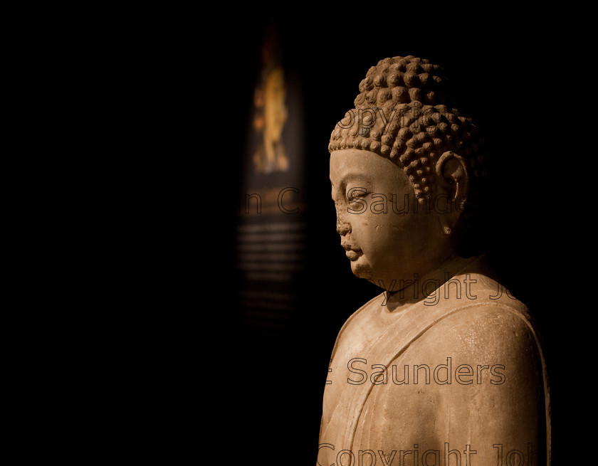 IMG 2789 
 Stone bust of an ancient chinese emperor from the side. From the Tang dynasty (618 - 907CE). 
 Keywords: Tang, ancient, art, black background, bust, chinese, culture, dynasty, emperor, history, sculpture, seated, shadows, statue, stone