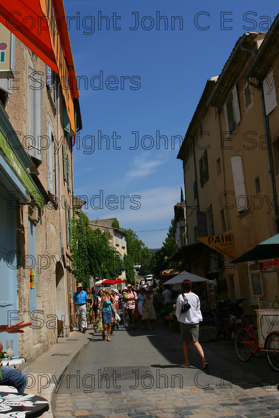 IMG 9472 
 Lourmarin street 
 Keywords: street,France,french,Lourmarin,summer,market,shops,blue,sky