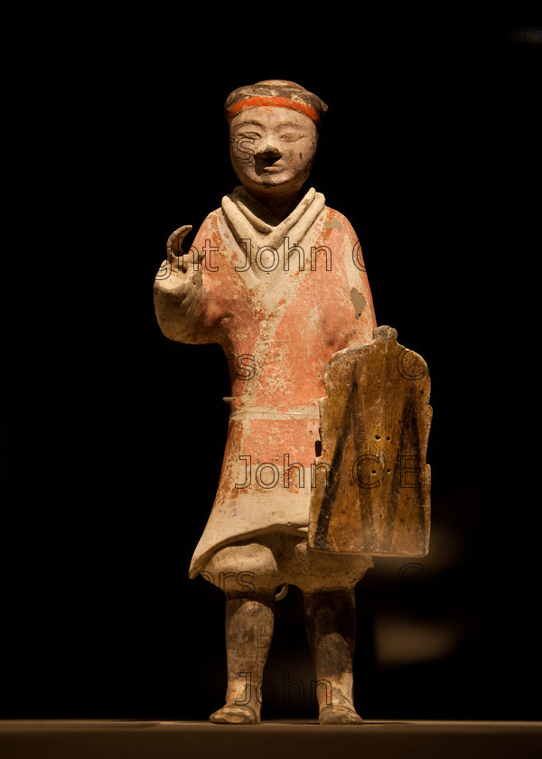 IMG 2738 
 Terracotta warrior clay statue from the Qin dynasty in China (220 - 206 BCE) 
 Keywords: Qin, ancient, art, brown, chinese, clay, culture, dark, dynasty, figure, head, history, red, sculpture, shadows, statue, terracotta, warrior