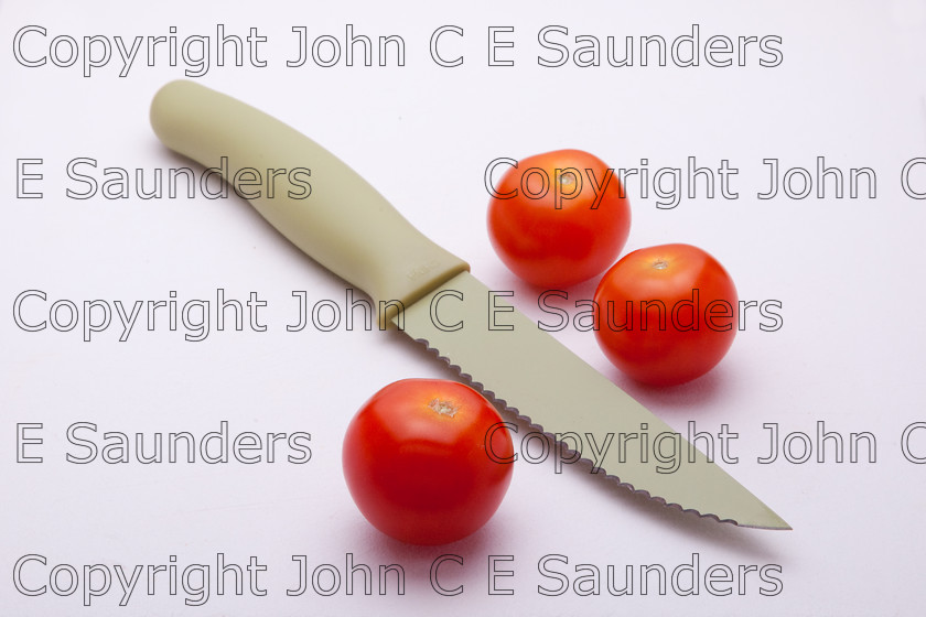 IMG 7774 
 Knife and tomatoes 
 Keywords: tomatoes,red,cherry,three,fruit,food,ingredients,healthy,isolated,white background,knife