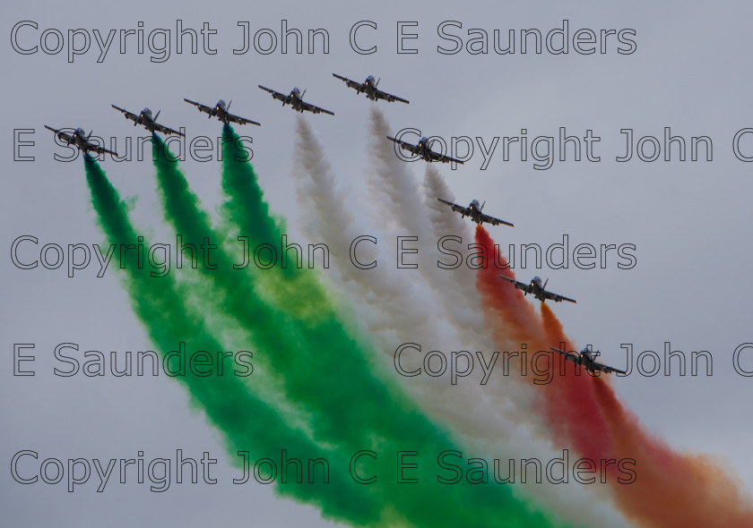 IMG 8307 
 Italian Air Force display team flying 
 Keywords: aircraft,formation,aeroplane,flying,display,sky,smoke,colours