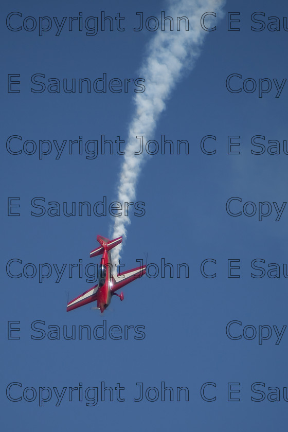 IMG 8389 
 Single aircraft diving 
 Keywords: aircraft,formation,aeroplane,flying,display,sky,blue,smoke,red,diving
