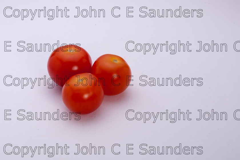 IMG 7792 
 Three cherry tomatoes 
 Keywords: tomatoes,red,cherry,three,fruit,food,ingredients,healthy,isolated,white background