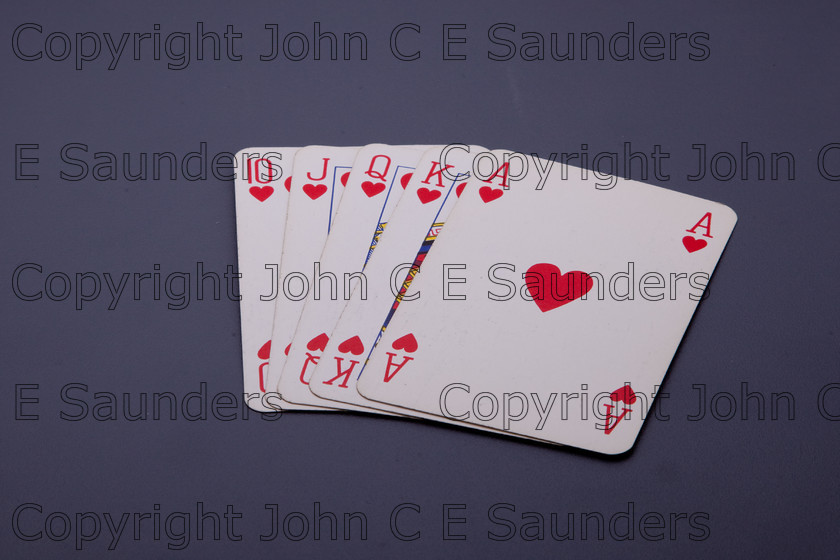 IMG 7814 
 Playing cards 
 Keywords: playing cards.royal flush,hearts,ace,king,queen,jack,ten,isolated,blue background