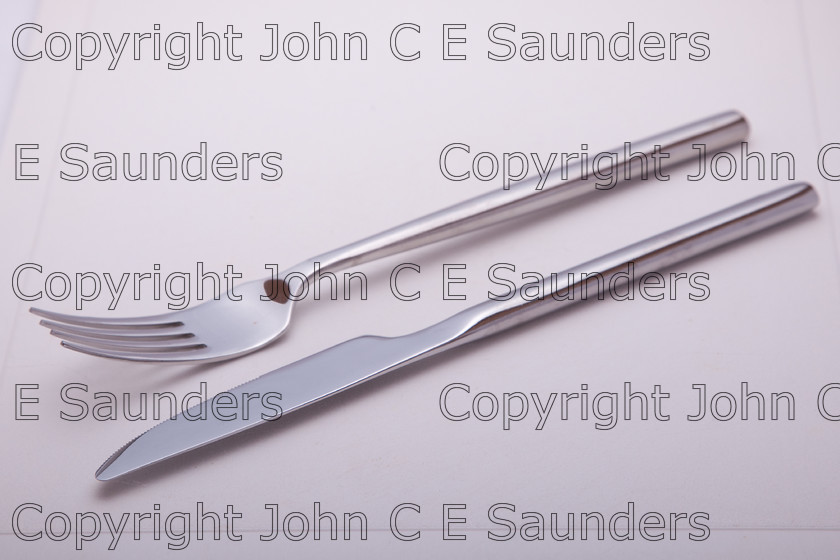IMG 7767 
 Knife and fork on white background 
 Keywords: Knife,fork,cutlery,stainless steel,eating,isolated,white background,modern
