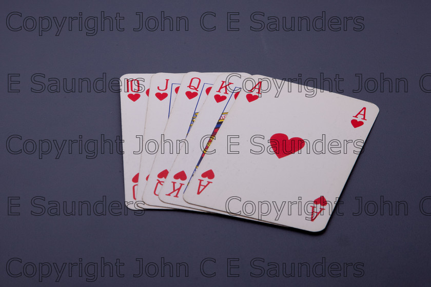 IMG 7815 
 Royal flush 
 Keywords: playing cards.royal flush,hearts,ace,king,queen,jack,ten,isolated,blue background