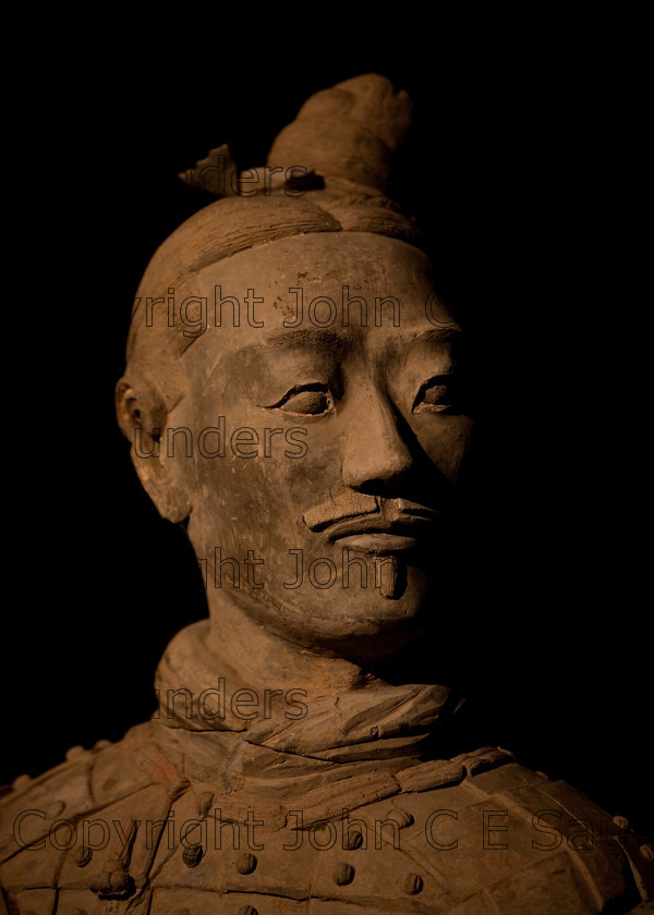 IMG 2730 
 Terracotta warrior clay statue detail from the Qin dynasty in China (220 - 206 BCE) 
 Keywords: Qin, ancient, art, brown, bust, chinese, clay, culture, dark, dynasty, head, history, sculpture, shadows, statue, terracotta, warrior